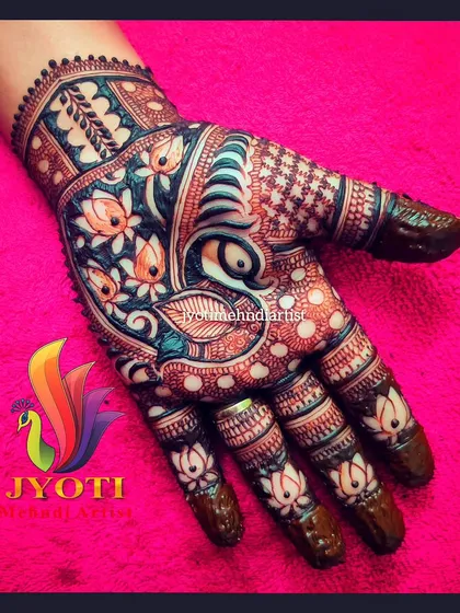 A colorful and vibrant example of a finished mehndi stain. This design features a peacock surrounded by lotus flowers, showing the beautiful reddish-brown color of my organic henna.