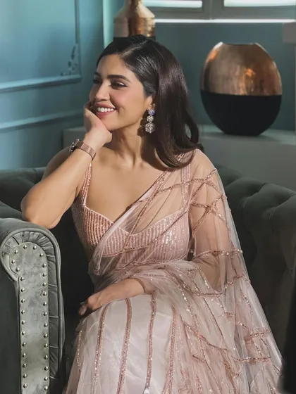 Pretty in pink! Here’s Bhumi Pednekar in a beautiful sequined saree by Masumi Mewawalla. This is a great option for a cocktail party or reception, offering sparkle and modern elegance.