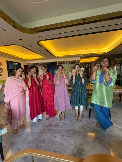 The happy group posing with their festive henna.