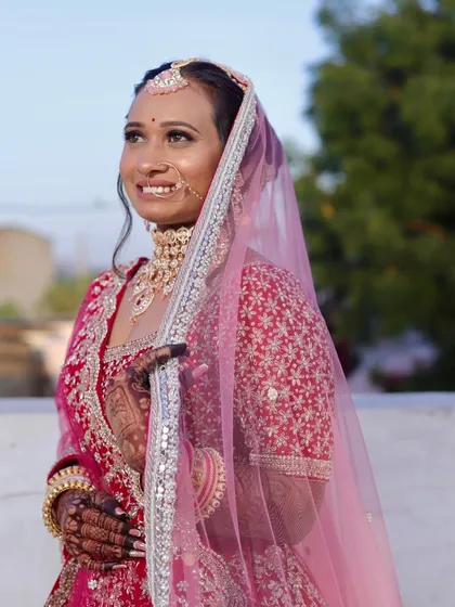 A candid moment of bridal joy. This look was all about soft, glowing skin and defined eyes, designed to look beautiful in natural sunlight and last throughout the day's events.