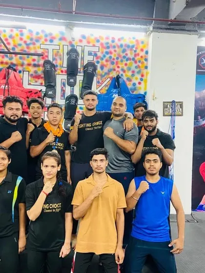 Team Fighting Choice Greater Noida. A diverse group of men, women, and kids, all part of the same fight family.