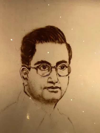 A close-up of the finished sand portrait of the founder, created live during the Jay Shree Tea corporate event. Capturing a likeness in sand is a challenge I truly enjoy.