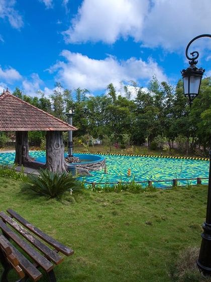 The beautifully landscaped grounds and a secondary pool at Coorg Cliffs Resort, showcasing the property's thoughtful design and serene atmosphere.