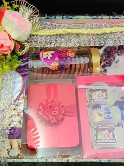 Another variation of the Rakhi tray hamper, with different packaging and contents.