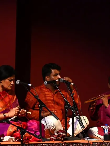 A close-up of the music ensemble during Stuti's arangetram. The vocalist, flautist, and I on nattuvangam are completely absorbed in creating the perfect musical support for the dancer.