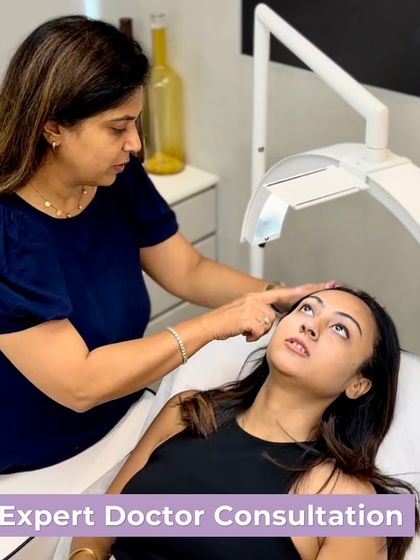 Every successful treatment plan begins with a thorough and honest consultation. Here, I am examining a client's skin to accurately diagnose the underlying issues before recommending a personalized treatment path.