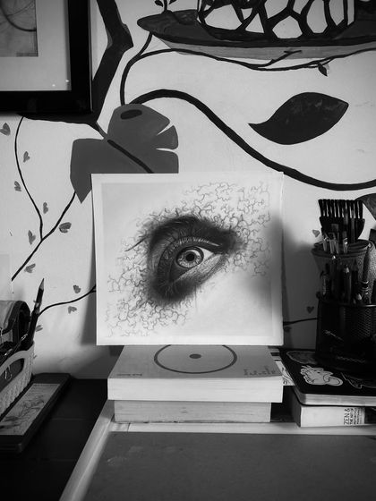 The abstract eye sketch on my desk, shown in black and white. The monochrome filter emphasizes the dramatic contrast I was aiming for.
