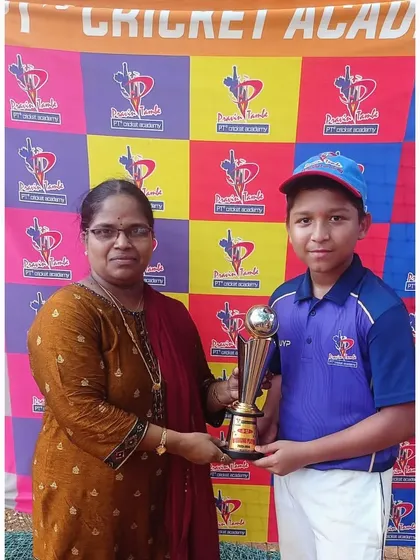 Kaushal Bhera proudly accepts the Best Batsman trophy for the U-12 tournament, recognizing him as the top run-scorer.
