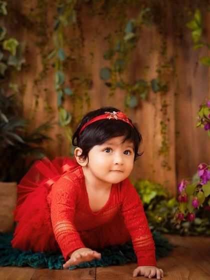 Capturing the start of a crawl. This dynamic shot shows her determination and curiosity in our indoor garden set.