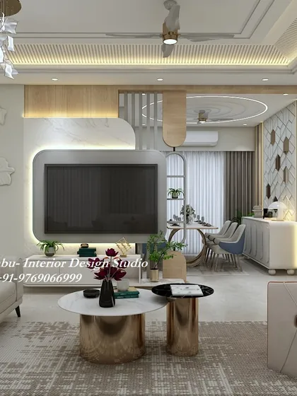 An open-concept living and dining area where a 3D floral wall sculpture and a modern TV unit command attention. The gold accents on the tables and furniture add a cohesive, luxurious feel.