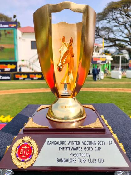 The Stewards Gold Cup, a striking all-gold trophy.