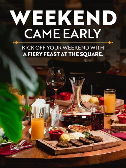 A fiery feast laid out on a table at The Square. This image invites you to kick off your weekend early with a culinary journey through my diverse restaurants like Punjab Grill and Dhaba.