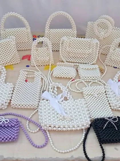 Beyond crochet, I also craft these intricate beaded handbags. This image showcases the different styles available for bulk order, from small clutches to larger totes and sling bags.