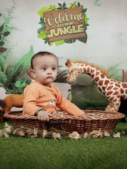 Our 'Welcome to the Jungle' set is filled with plush animal friends. This setup provides a safe and engaging environment for your child's safari adventure photoshoot.
