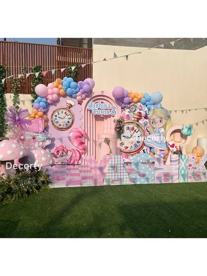 The full outdoor setup for the Alice in Wonderland party, showing the scale and vibrant colors.
