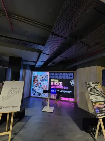 Another view of the main stage at the Broadway event. The large LED screen, branded easels, and open space are all part of our plan to create an engaging and professional atmosphere.
