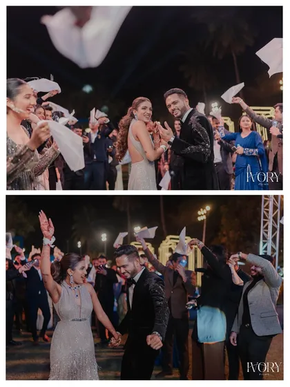 The couple's grand entrance to the party. We capture their joy as they are welcomed by friends and family with a fun napkin-waving celebration.