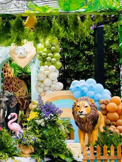 A view of the diverse animal props used in Eshaan's safari theme, including elephants, lions, and flamingos, creating a lively jungle scene.