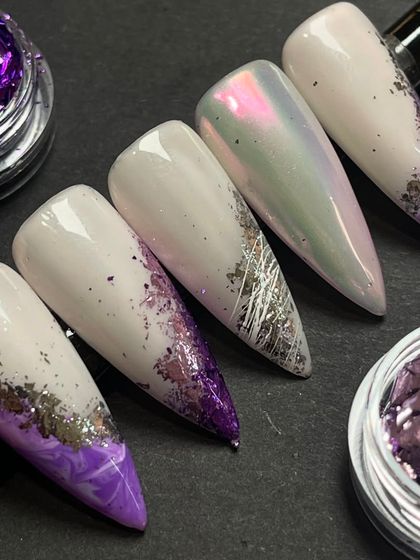 A purple paradise created by our nail trainer. This set features a stunning combination of marble art, chrome powder, and foil flakes for a multi-dimensional design.