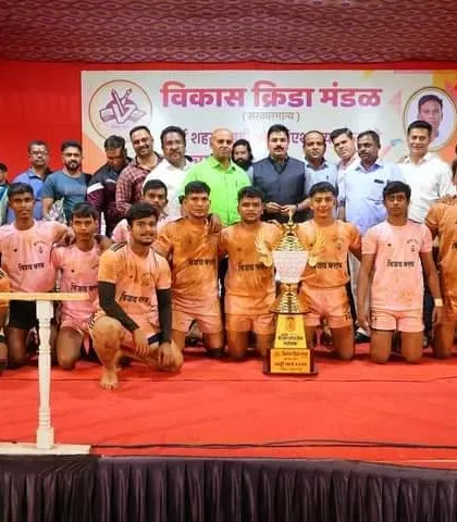 The team on stage with officials after the Vikas Krida Mandal tournament.