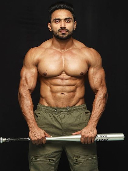 Holding the bat, ready for action.