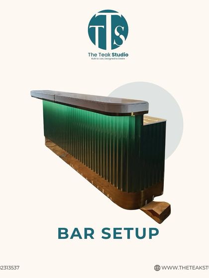 Elevate your entertaining space with a chic home bar. This design features a fluted glass front with green backlighting and a solid wood top, creating a stylish focal point for any social gathering.