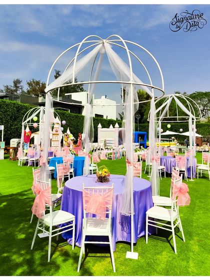 For the Disney-themed party, I set up these elegant gazebos for guest seating. Draped with sheer white and pink fabric, they provide shade while adding a touch of fairytale romance to the garden setting.