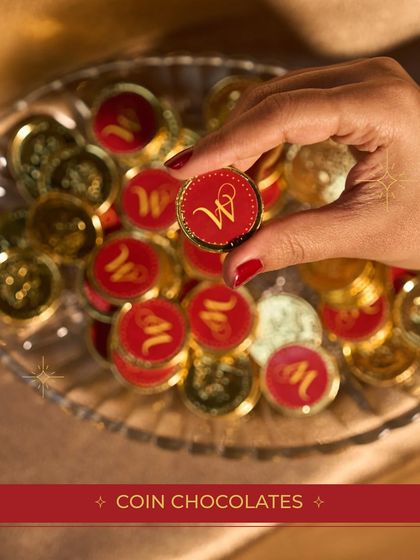Our custom-branded coin chocolates are a sweet and memorable addition to any festive hamper, seen here as part of the Diwali collection.