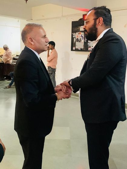 A handshake congratulating a colleague on his election victory. These connections across the bar are invaluable.