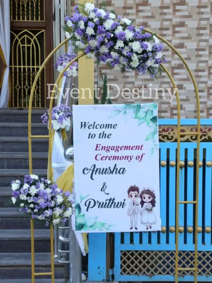 A personalized welcome sign for Anusha and Pruthvi's engagement ceremony. We create custom signage framed by floral arrangements to greet your guests.
