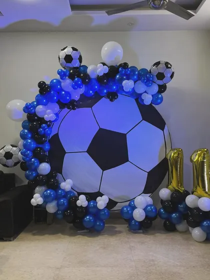 Another shot of the football party setup, showing the '11' foil balloons.