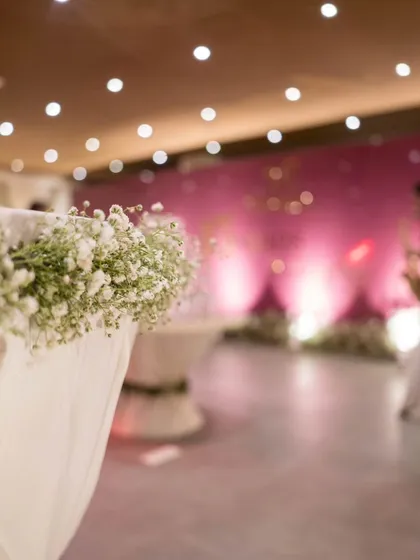 A detail shot focusing on the delicate baby's breath adorning the cocktail tables, showcasing our attention to the smallest elements.