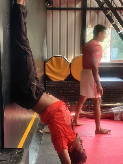 An inverted wall stretch to open up the shoulders and improve back flexibility.