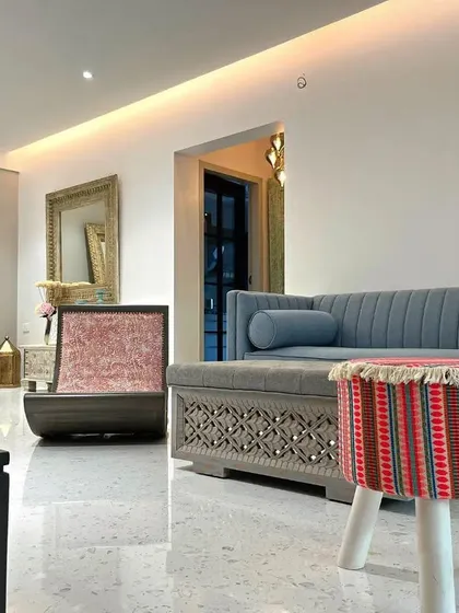 This shot captures the eclectic mix of furniture in the Bohemian-style house in Bandra. The combination of different textures, patterns, and styles results in a unique and personal living space.