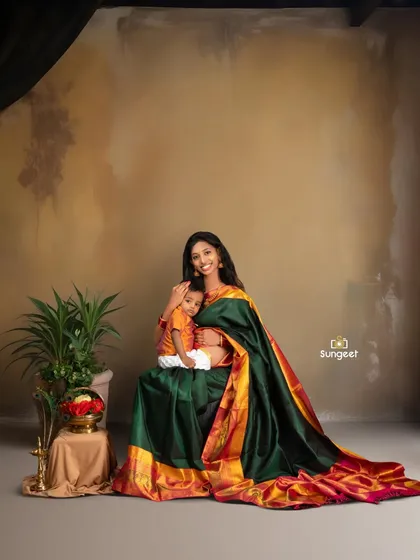 Timeless elegance in a traditional silk saree. A maternity shoot is a wonderful opportunity to celebrate your culture and create regal, artistic portraits with your older child.