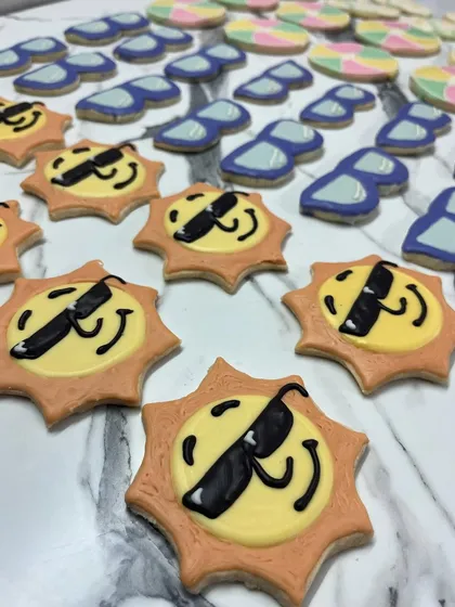 Fun in the sun! These cool sun and sunglasses cookies are perfect for a summer-themed party or a pool party. They add a touch of playful sweetness to any event.