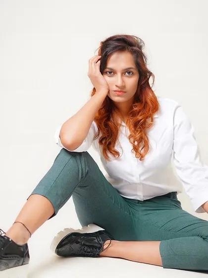 A classic seated portrait that is both casual and confident, perfect for a commercial or lifestyle portfolio.