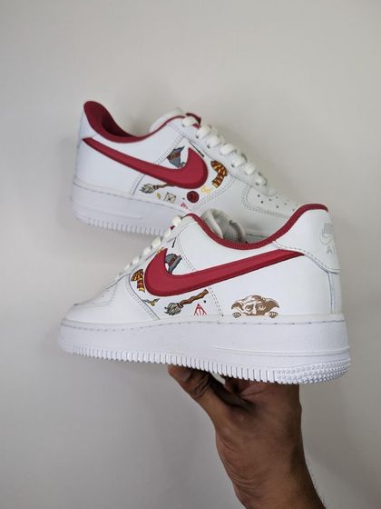 Holding up the completed Harry Potter custom. The red and gold color scheme is classic Gryffindor.