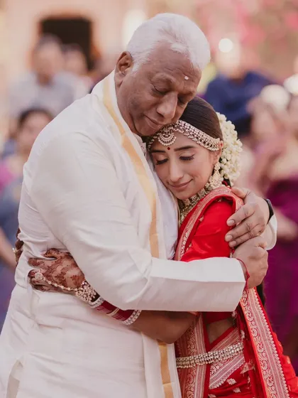 An emotional, unscripted moment between a bride and her father. For us, capturing these profound, heartfelt connections is just as important as the grandest ceremonies.