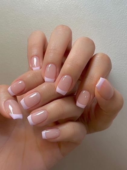 A classic French manicure done with gel polish on natural, squared nails. This shows that you don't need extensions to achieve a polished and timeless look.