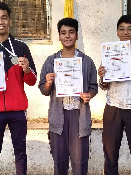 Our state championship winners holding their certificates and medals, proof of their hard work.