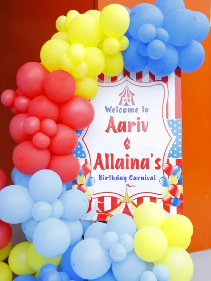 A personalized welcome sign for Aariv and Allaina's birthday carnival. The bright, primary colors are perfect for a fun and festive circus theme.