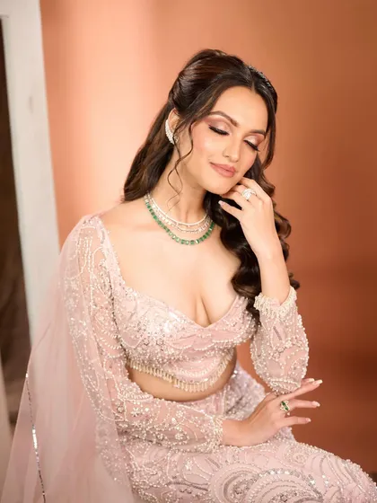A serene and elegant pose. This image shows how the soft glam makeup creates a polished and sophisticated look, perfect for a bride who wants to feel effortlessly beautiful.