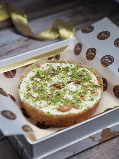 Each Ghewar is packed with care in our custom boxes, ensuring it reaches you fresh and beautiful. This Malai Ghewar is ready to be gifted.