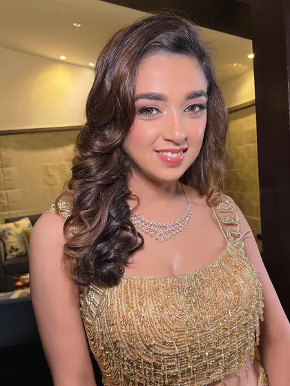 A bright and happy portrait of this Sangeet bride. Her makeup is kept fresh and radiant to let her natural beauty shine.