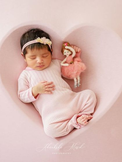 Cradled in a heart, this little one is surrounded by love. I use simple, meaningful props like this heart-shaped bowl to create sweet and symbolic newborn portraits.