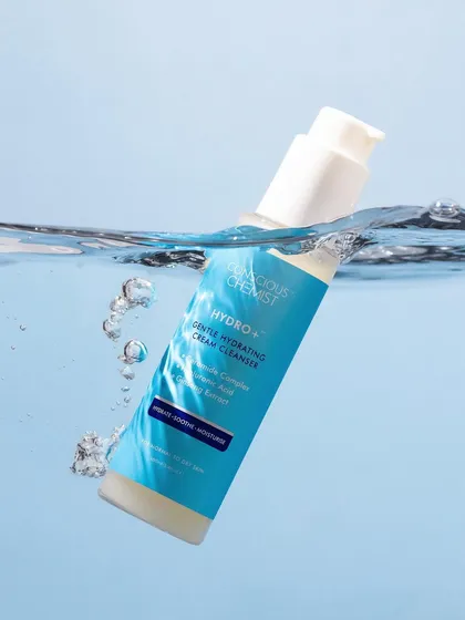 This shot creates the illusion of the product dipping into water. The clean splash and bubbles add a sense of freshness and movement, perfectly highlighting the cleanser's hydrating properties.