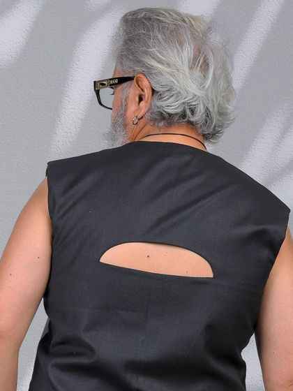 A close-up detail shot of the cutout on the back, showing the garment's unique design features.