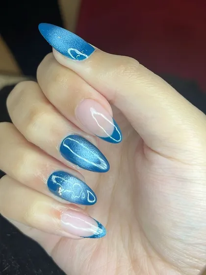 Another angle of the stunning blue aura cat eye nails.