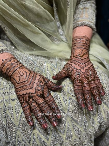 An elegant design with Arabic calligraphy at the center, surrounded by intricate traditional patterns.